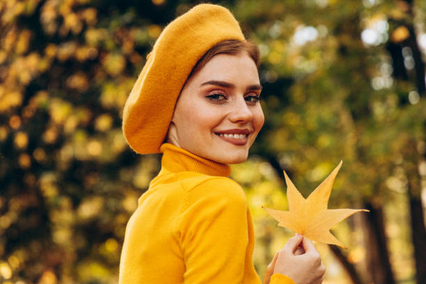 Beautiful woman enjoying autumn