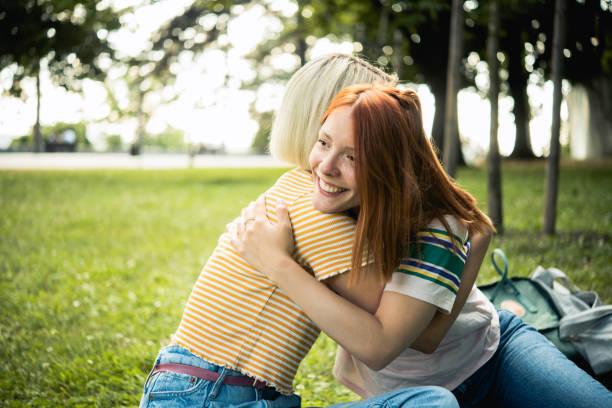 istock Two cheerful friends are hanging out outside 1519737646