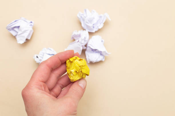istock crumpled yellow and white paper as a concept creative idea and innovation 1519748234