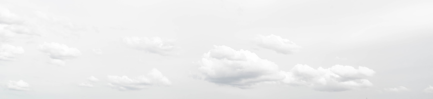Panorama photo of white fluffy cloudscape scenery, fresh environment background. Cumulus clouds floating in light and bright sky. Freedom of nature.