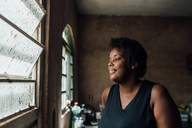istock Smiling woman in humble house 1519778599