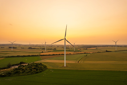 renewable energy: wind turbines at sunset