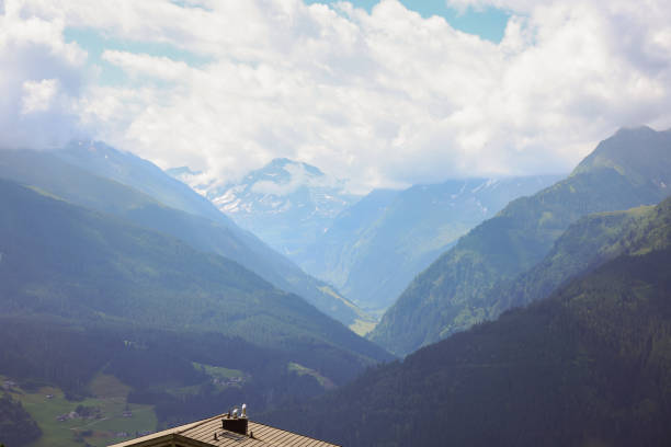 Fantastic evening snow mountains landscape background. blue clouds overcast sky. Wilder Kaiser