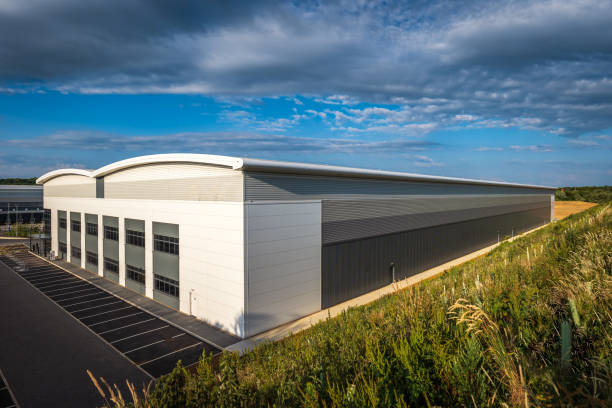 Industrial distribution warehouse construction frame in england uk sunset