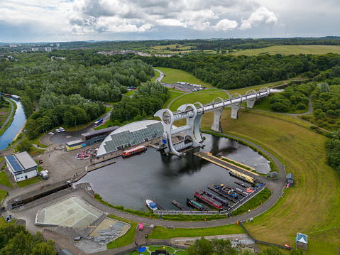 This aerial drone photo shows the famous Falkirk Wheel from above. The Falkirk Wheel is a boat lock in Scotland.