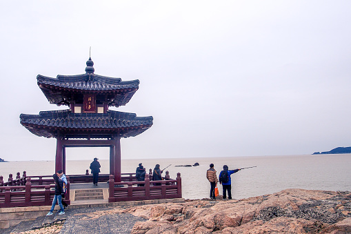 ZHEJIANG,CHINA 4 february 2022 - many tourist come to visit Zhaizhai pavillion,locate in Putuoshan island