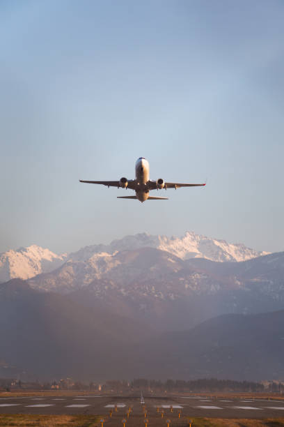 istock passenger airplane taking off against the backdrop of mountains 1519840340