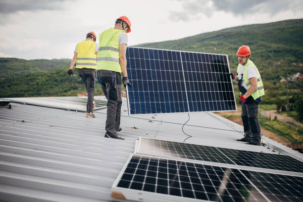 istock Solar panels installers on the roof 1519851655
