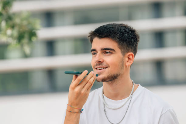istock young man sending voice message with mobile phone 1519867629