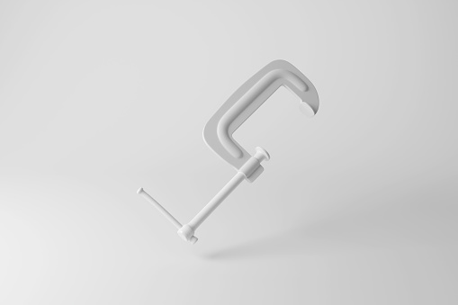 White g-clamp floating in mid air on white background. Illustration of the concept of carpentry and welding