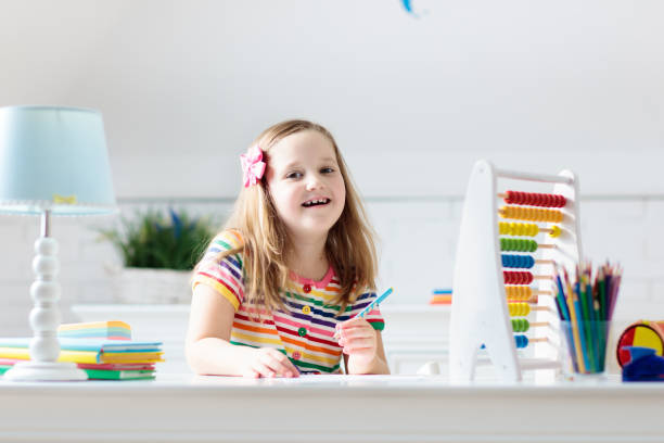 istock Child with abacus doing homework after school. 1519901542