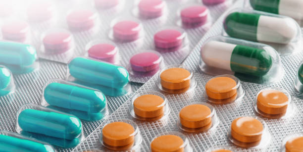 istock many colored tablets, pills and capsules. View from above. 1519944655