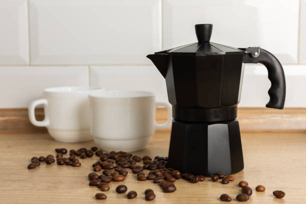 istock Geyser coffee maker with coffee beans on a light background. Kettle for making coffee. The concept of making aromatic coffee. Good morning . Place for text. copy space. 1519945918