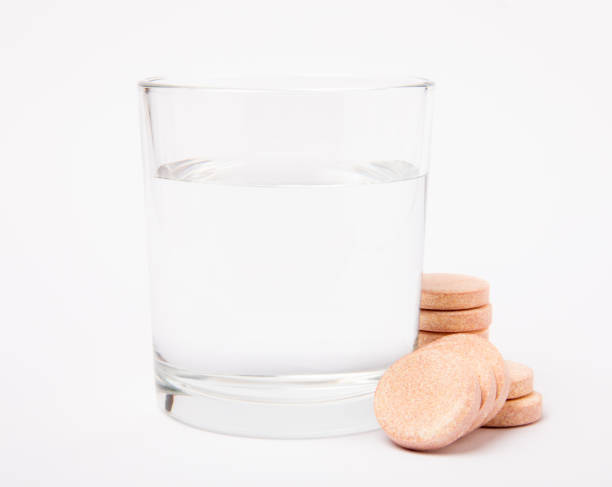 istock Glass with effervescent tablet in water. Isolated on white background. Vitamins. 1519976842