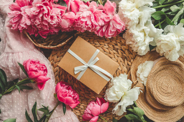 istock Gift box with bow and pink peonies, holiday concept 1519982369