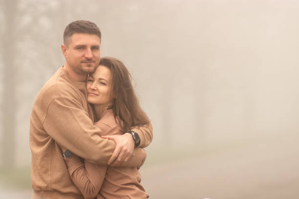 spouses in the fog - vacations women men stability imagens e fotografias de stock