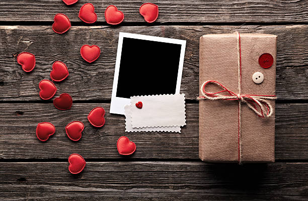 istock Photo frames with vintage gift box on wooden table. 152000821