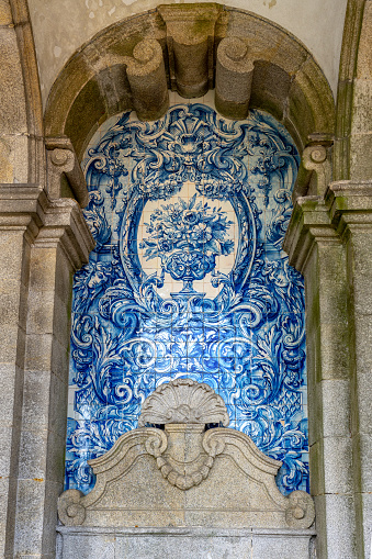 Porto Se cathedral with blue white azulejo ties in Porto Portugal .