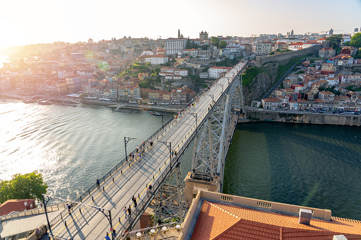 dom luiz brige in Porto on the riverside of Duero river cityscape at sunset from above view from Mosteiro da Serra do Pilar .