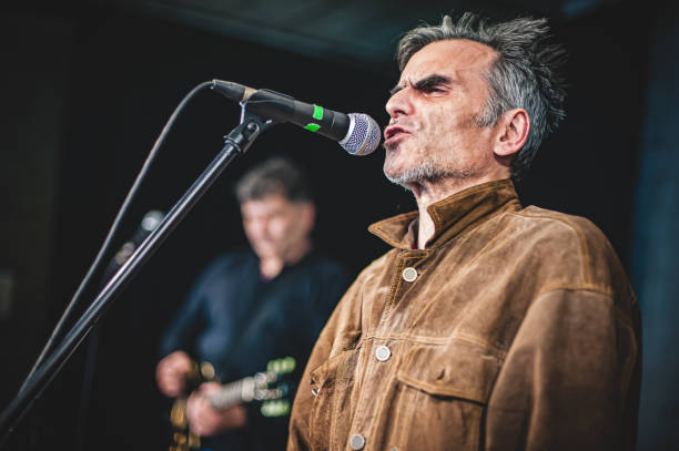 istock Singer artist performer close-up portrait during live performance on stage 1520025101