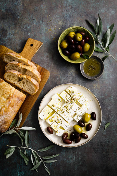 istock Feta cheese, olives and ciabatta, top view 1520036625