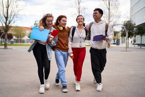 istock Diverse group of students walking outside the university, talking and having fun. 1520068661