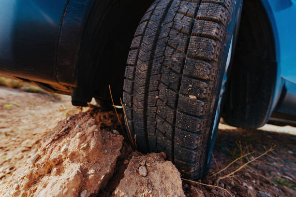 car wheel standing on stones close-up view - 12026 imagens e fotografias de stock