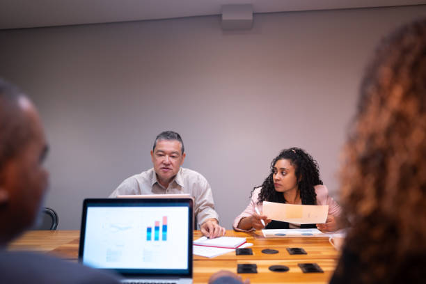 istock Coworkers talking during a meeting at office 1520139905