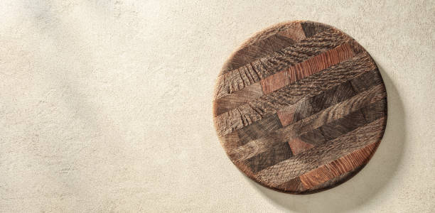 istock Old pizza board or cutting board on sand stone texture 1520155134