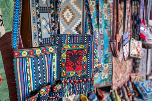 Vibrant colors of a traditional Andes textile on the local art and craft market of Otavalo, Ecuador. Textiles are found in the Andes countries of Bolivia, Ecuador and Peru.