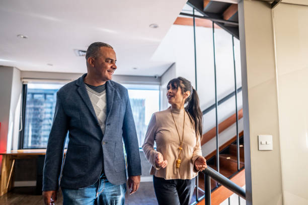 istock Coworkers talking and walking at office 1520158414