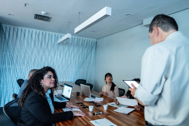 istock CEO/Manager talking with employees while use a digital tablet during a meeting at office 1520210080