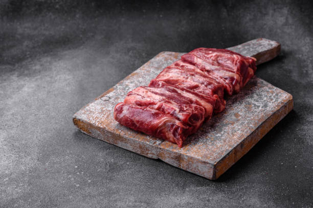 istock Fresh raw beef ribs with salt, spices and herbs 1520216130