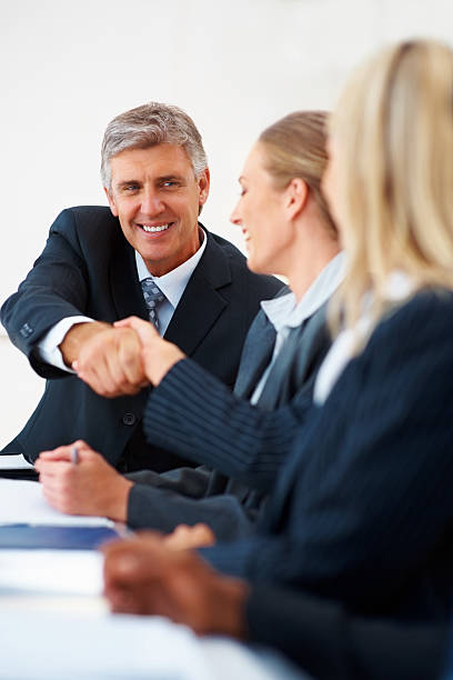 istock Happy business colleagues shaking hands 152021961