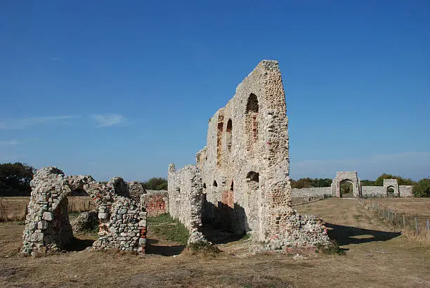 View of the ruins of Greyfriars Friary, near Greyfriars Wood, Dunwich. The Friary was founded before 1277, but had to be moved further inland in 1289. The last remains of medieval Dunwich, the church, refectory and cloisters have all been lost to the sea. Parts of the Gatehouse archway and a smaller doorway can still be seen.