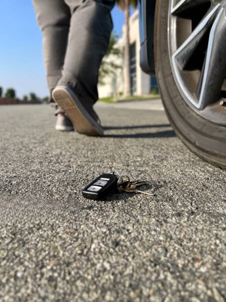 istock Man walks away from keys on the street 1520245584