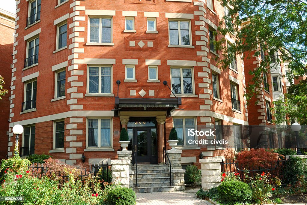 A brick apartment building front in the city Luxury apartment building with a stone entrances Apartment Stock Photo