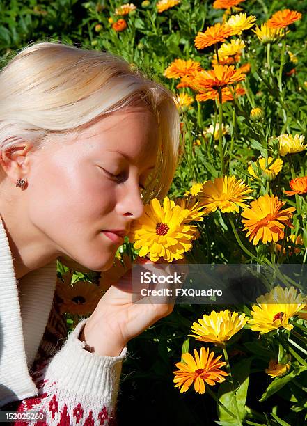 Portrait Of Happy Young Woman With Marigold Stock Photo - Download Image Now - Adult, Backgrounds, Beautiful People