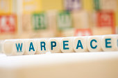 War and Peace Spelled With Scrabble Tiles