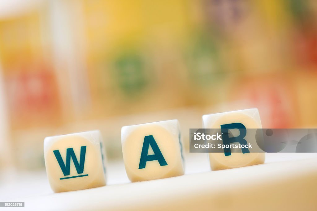 Word "WAR" Spelled With Scrabble Tiles Close-up of the word "WAR" built with Scrabble Tiles. Alphabet Stock Photo