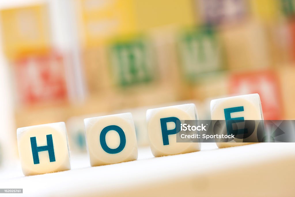 "HOPE"  Spelled With Scrabble Tiles Close-up of the word "HOPE" spelled with Scrabble Tiles. Text Stock Photo