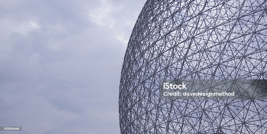 Buckminster Fullers Geodesic Dome Buckminster Fullers 1967 geodesic dome against a cloudy sky. Geodesic Dome Stock Photo