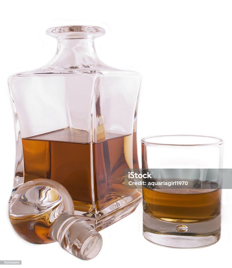 The booze A crystal carafe filled with booze on a white background Decanter Stock Photo