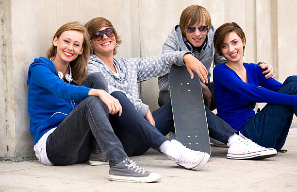 istock Teenagers Sitting by a Wall 152027104