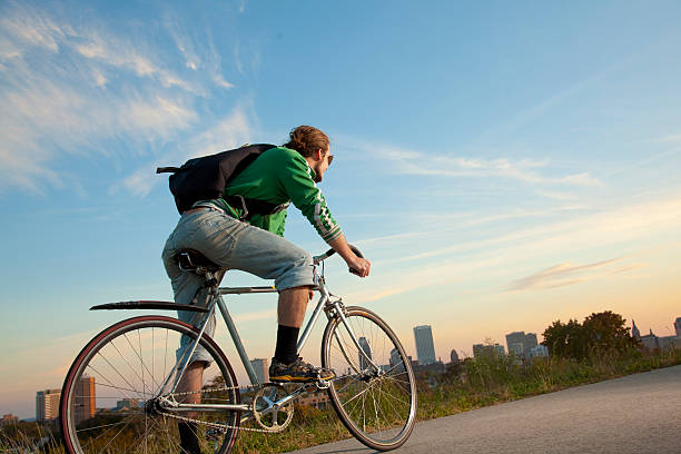 Bike Messenger in front of a City stock photo