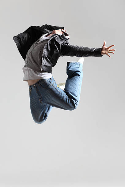 istock A young man jumping in a very expressive dance move 152027714
