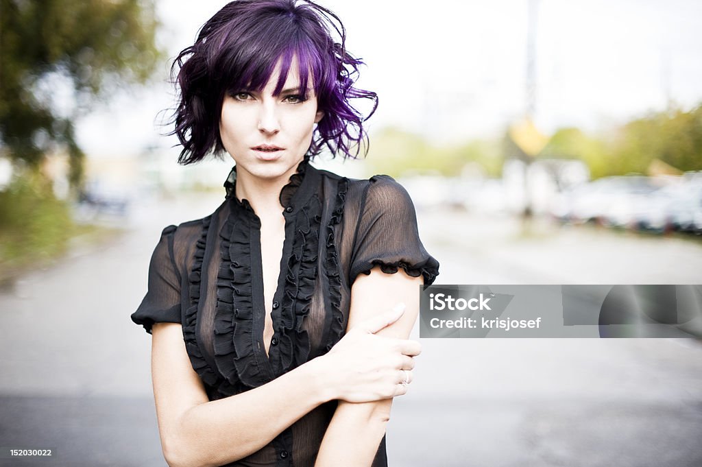 Model with purple hair outdoors Pretty model with purple hair in black blouse on street. Blouse Stock Photo