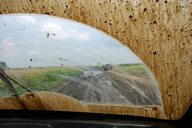 A view of daytime traffic in the side mirror of a car travelling on Interstate 70 in Colorado.