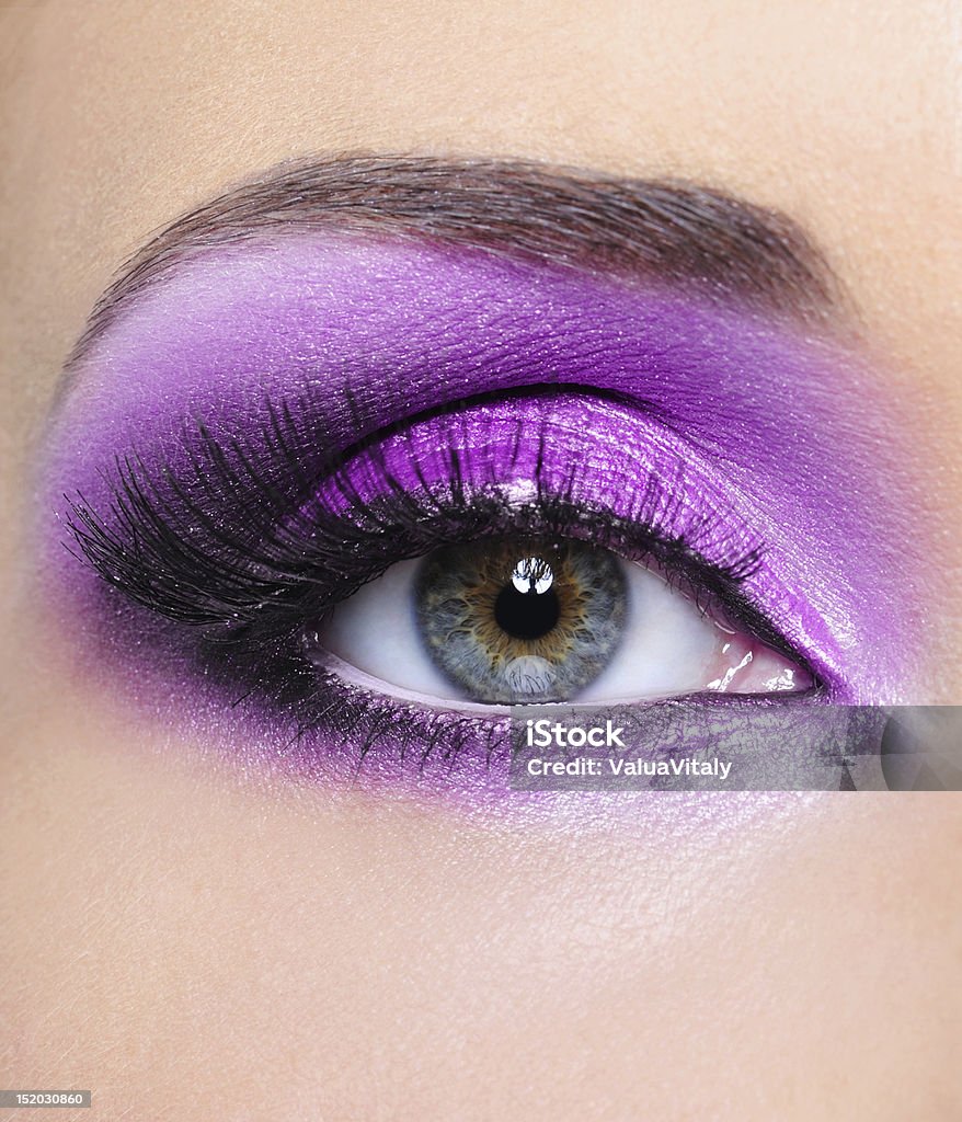 Purple  make-up of woman eye Purple shine make-up of woman eye - mfront view Bright Stock Photo