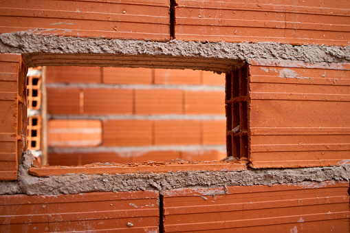 Building under construction. Details of exterior brick and cement walls- Buenos Aires - Argentina